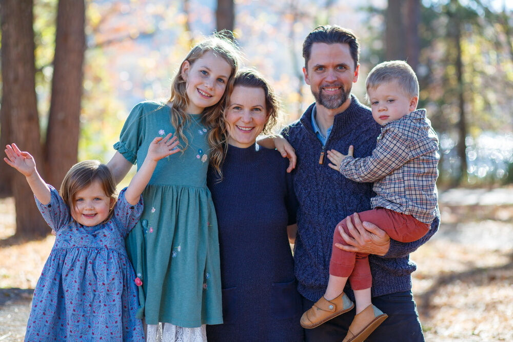 The family behind A Pumpkin Story, together among autumn trees